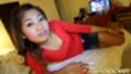 Lying on bed wearing red top