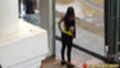 Long hair down her back bou standing on street