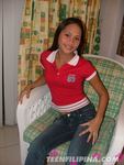 Red Top Blue Jeans Sitting On Chair