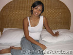 Filipina Women Grace Rocha Sitting On Bed