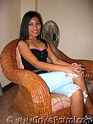 Jane Hernanded Sitting On Wicker Chair