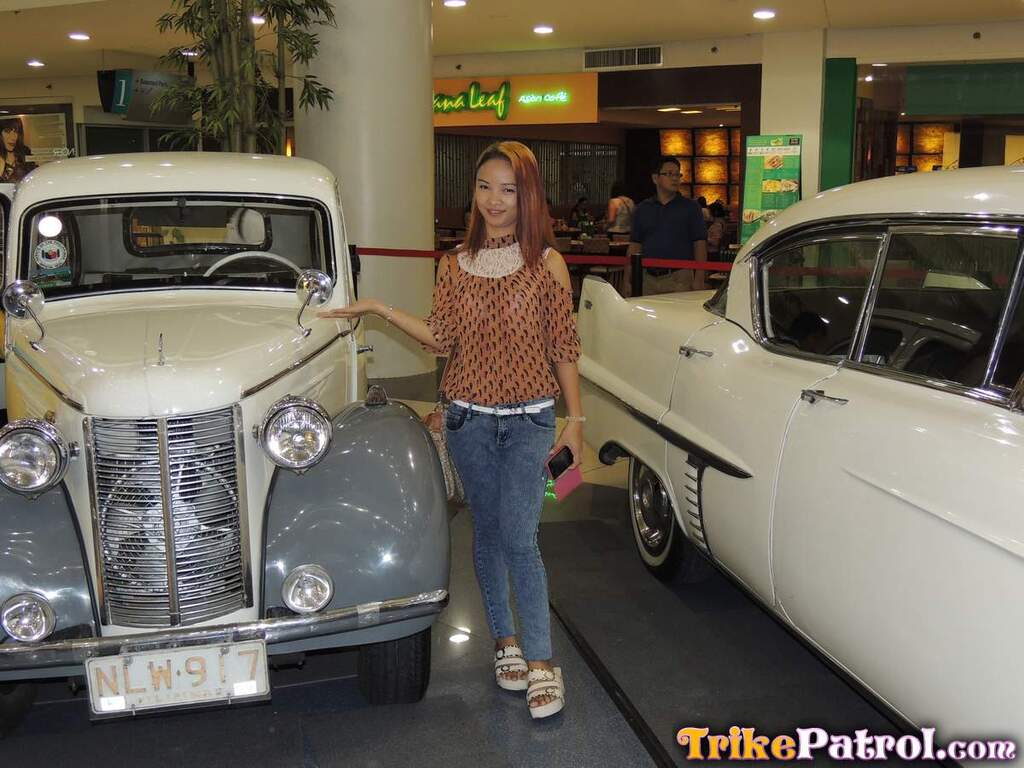 Ayumi posing with vintage cars