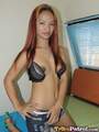 Ayumi kneeling on bed long hair down to her small breasts hand on hip